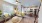 a living room with a kitchen and a couch
