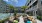 a courtyard with couches and tables