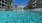 a pool of water surrounded by buildings