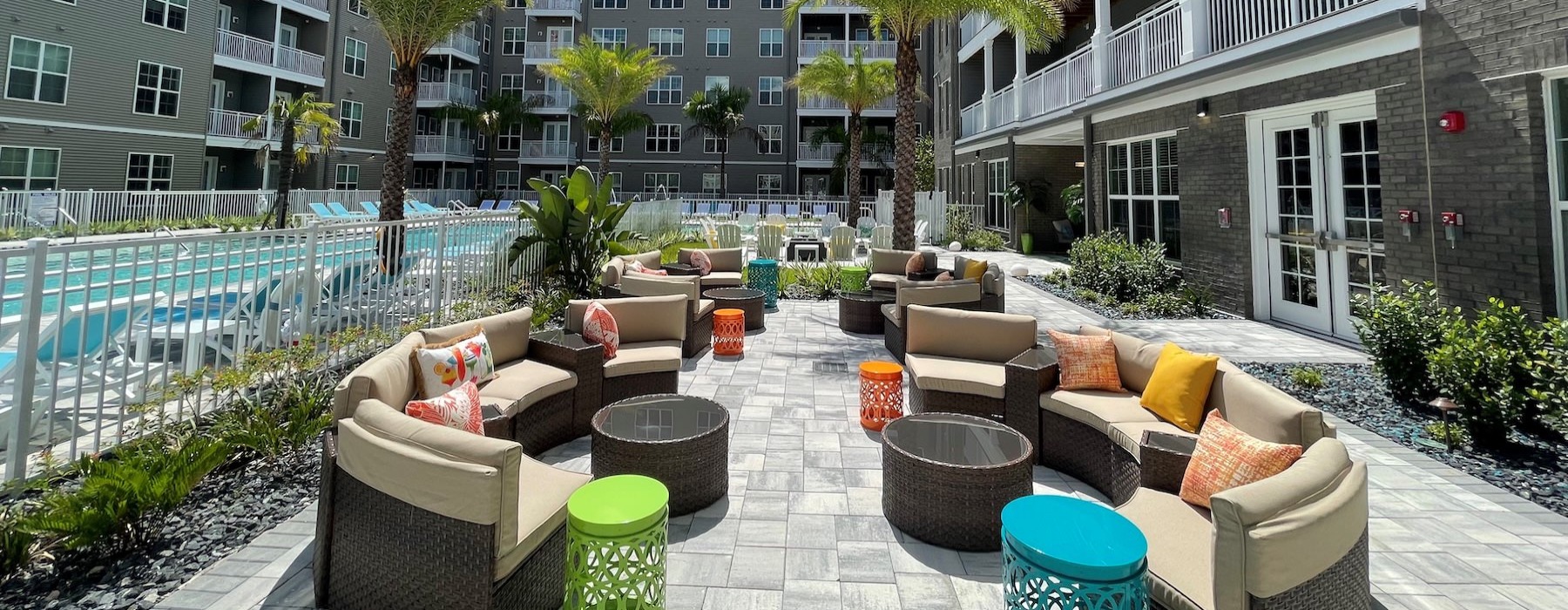 a courtyard with couches and tables