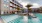 a swimming pool in front of a building
