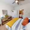 a bedroom with a bed and a dresser