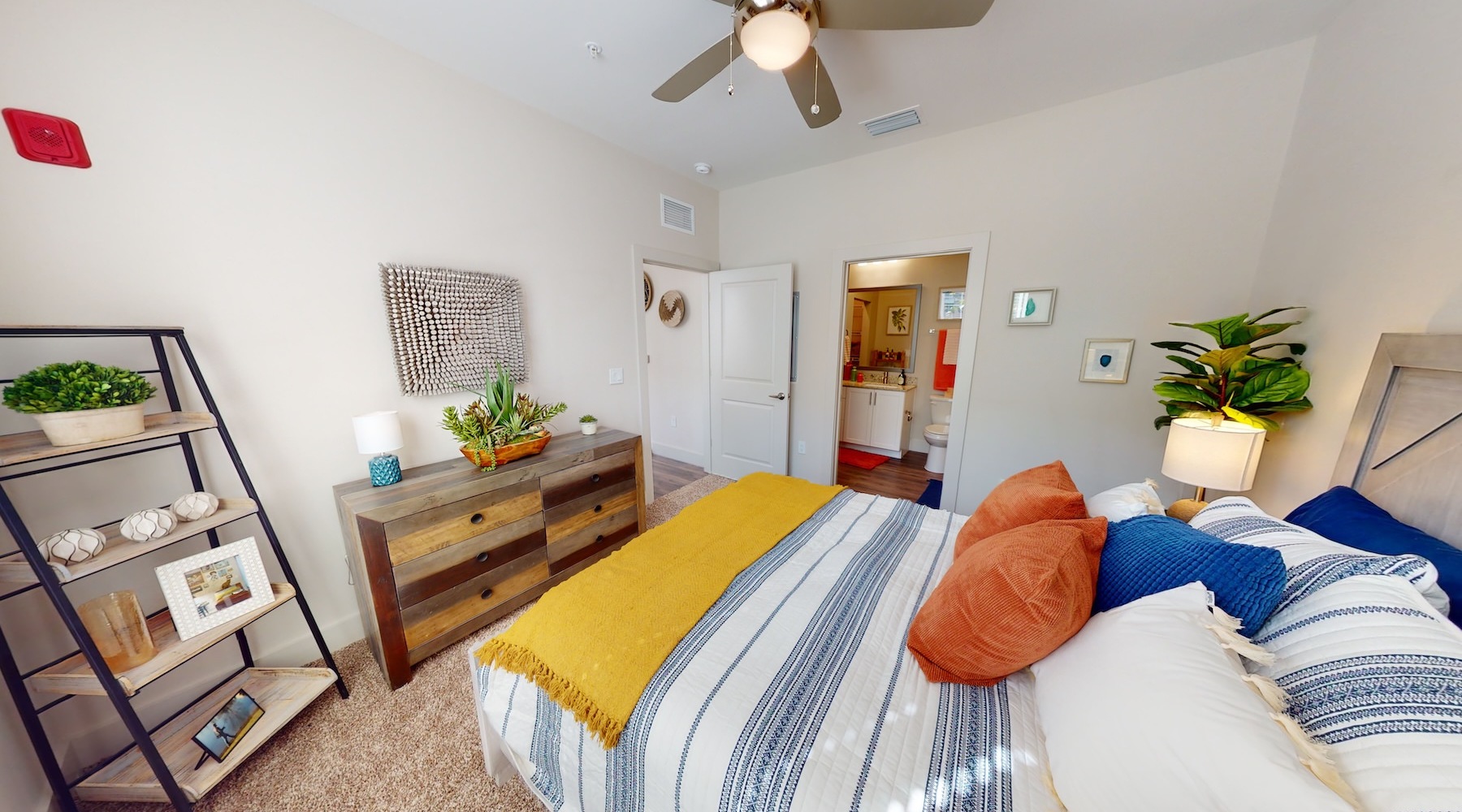 a bedroom with a bed and a dresser