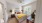a bedroom with a bed and a fan