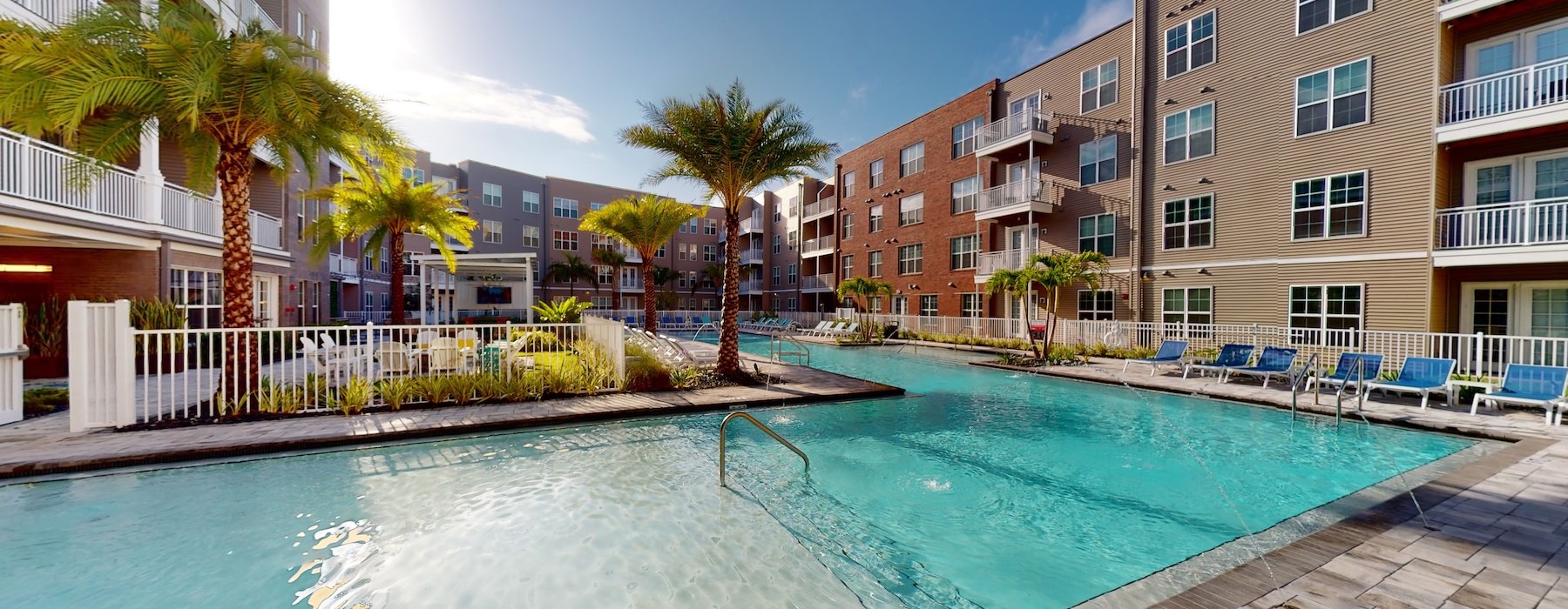 a swimming pool with palm trees