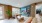 a clubroom with a tv and furniture