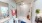a bathroom with a tub, toilet and sink